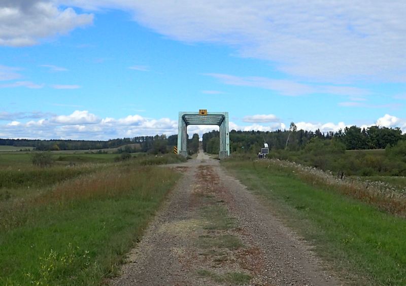 Looking North up Range Road 53 and the bridge crossing Tomahawk Creek, 2024-09-18-ModesteSask-NA, P. Potter.