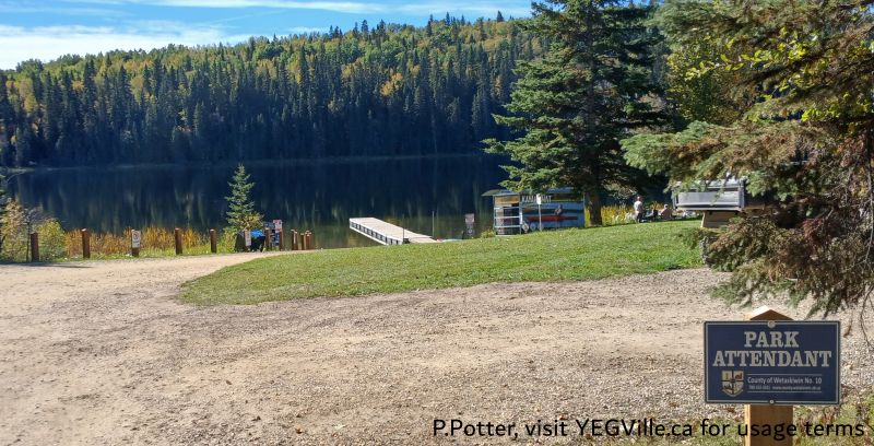 The view from the access road looking, note the kayak rental station midframe, Twin Lake-Winfield, 2024-09-24, P. Potter.
