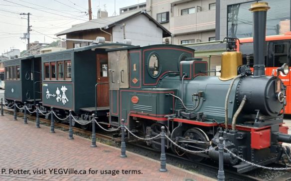 A restored, functioning, and protected ‘Botchan Train’ next to the Dogo Onsen Honkan (hot spring), 2026-04-09, Matsuyama and area, P. Potter.
